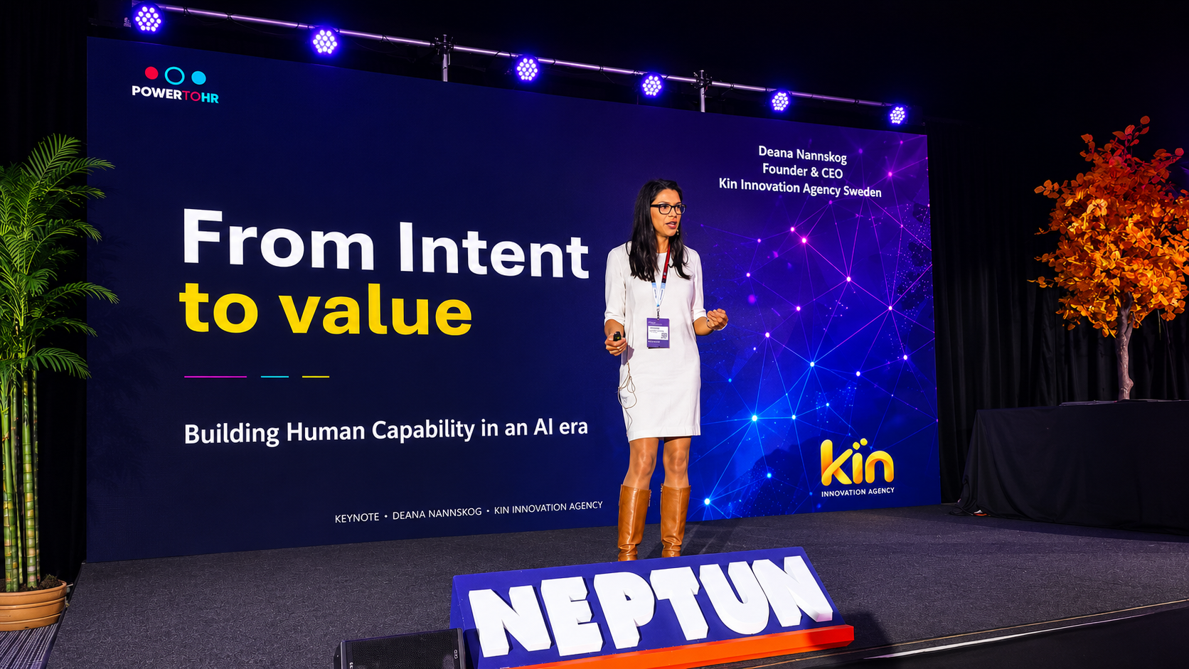 Deana Nannskog on stage delivering a keynote at PowerToHR